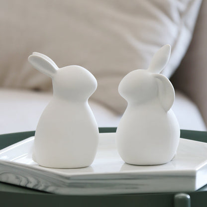 Minimalistische weiße Keramik-Kaninchenfiguren
