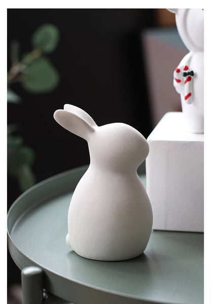 Minimalistische weiße Keramik-Kaninchenfiguren